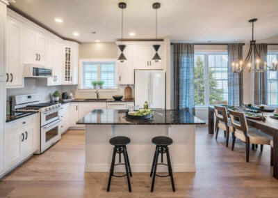 The Betsy Ross Kitchen with center island white cabinets and black counters