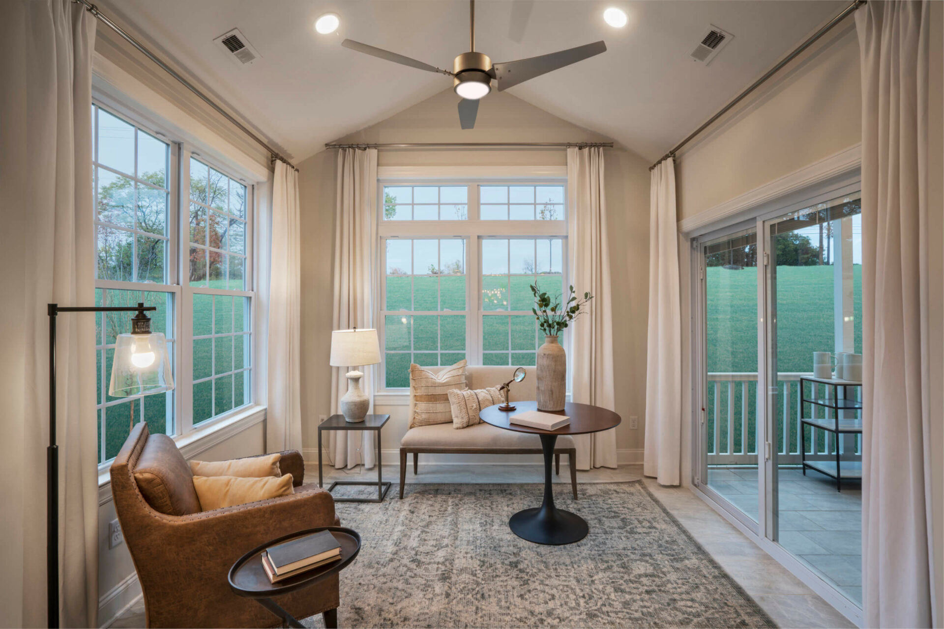 Sun room with ceiling fan from Traditions of America