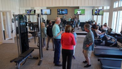 Active Adult community Residents viewing the fitness center