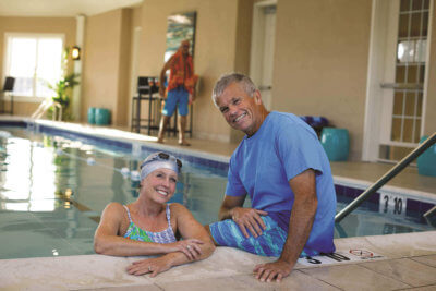 Couple at Silver Spring Active Adult Community indoor Pool