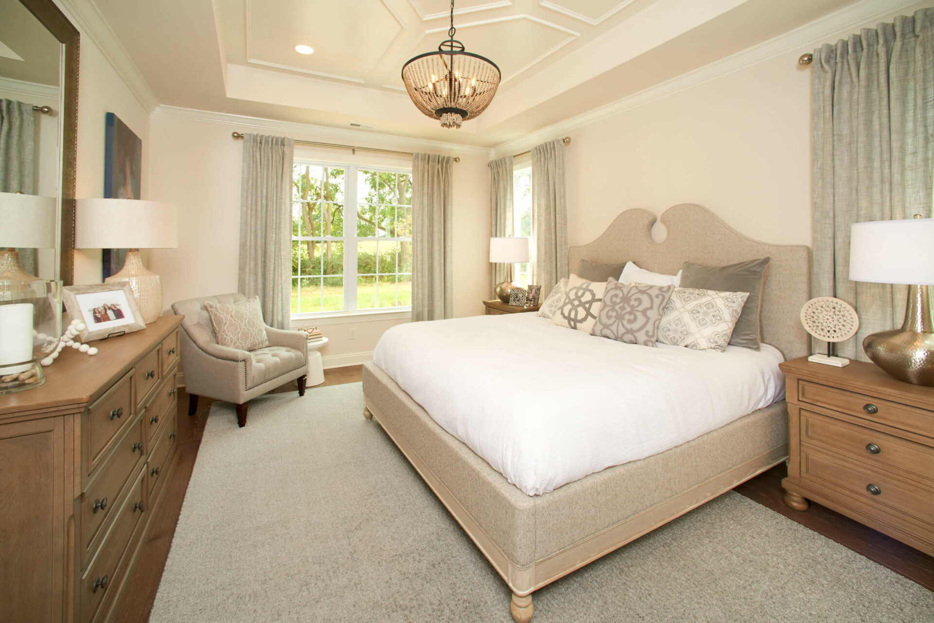 Bedroom with large bed and tray ceiling from Traditions of America