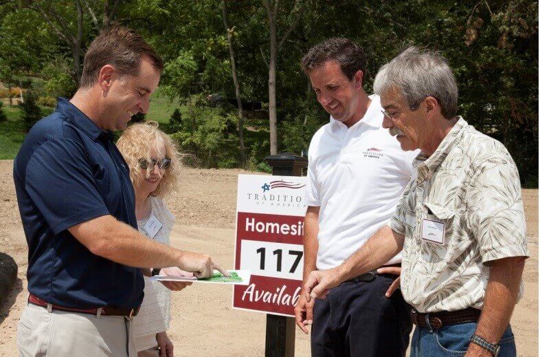 People look at a homesite from traditions of america