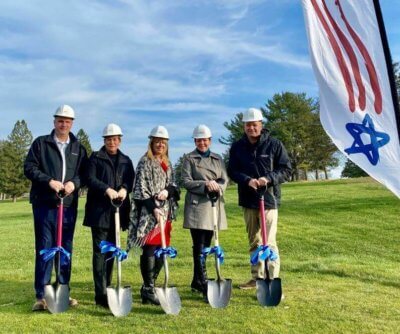 Five Traditions of America employees posing with shovels