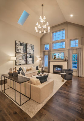 Great room with a fire place and large ceilings in the franklin model