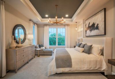 Master Bedroom with large windows and seating area in the Franklin Model