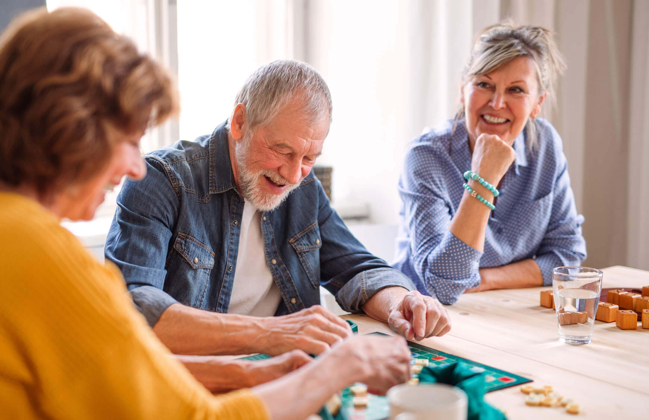 Active adults playing board games with each other