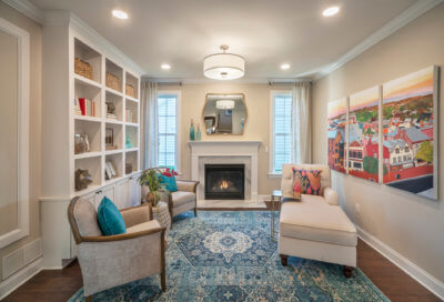 Living Room of the Washington Model with White chairs and a blue rug