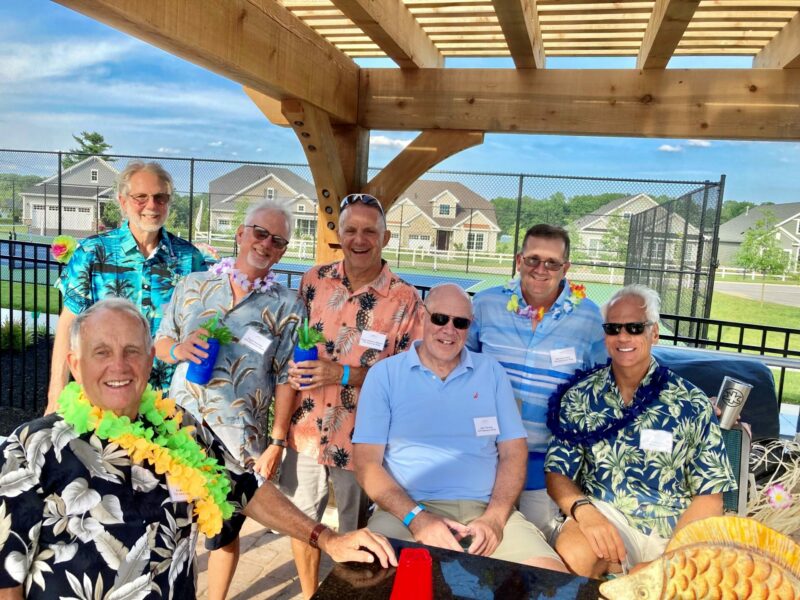 West Brandywine residents sitting and drinking during a luau