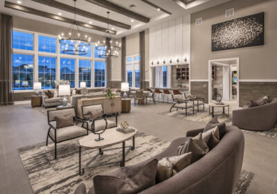 Lounge area with a tv and bar in a traditions of America community clubhouse