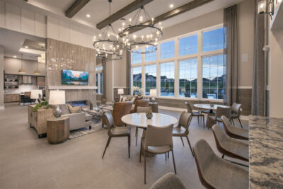 Lounge area with a tv and bar in a traditions of America community clubhouse
