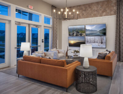 Lounge with four tv's in a traditions of America community clubhouse