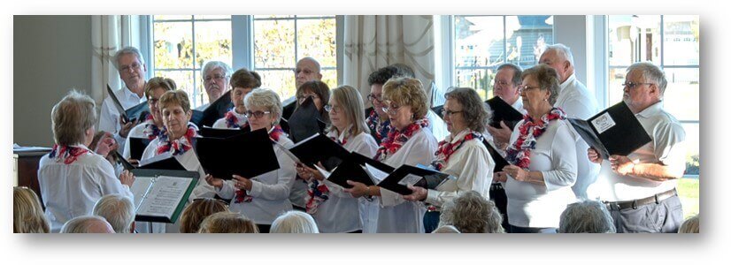 Choir singing inside the Traditions of America community clubhouse