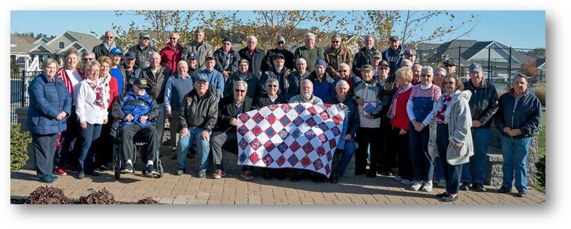 People standing around outside in a traditions of America community