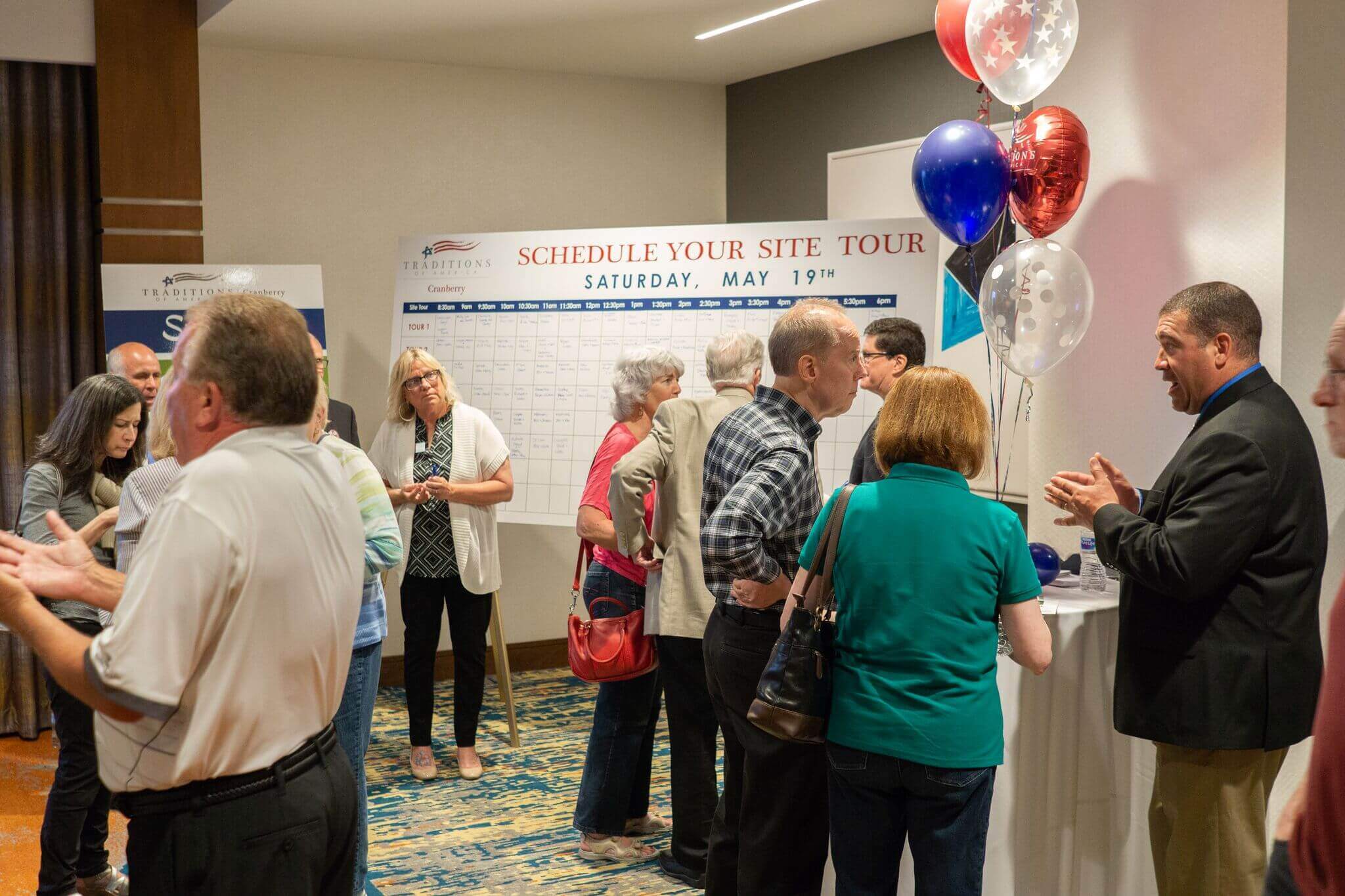 Dan, at far right, speaking to customers about the building process at Traditions of America- Active Adult Communities Dan, at far right, speaking to customers about the building process at Traditions of America- Active Adult Communities