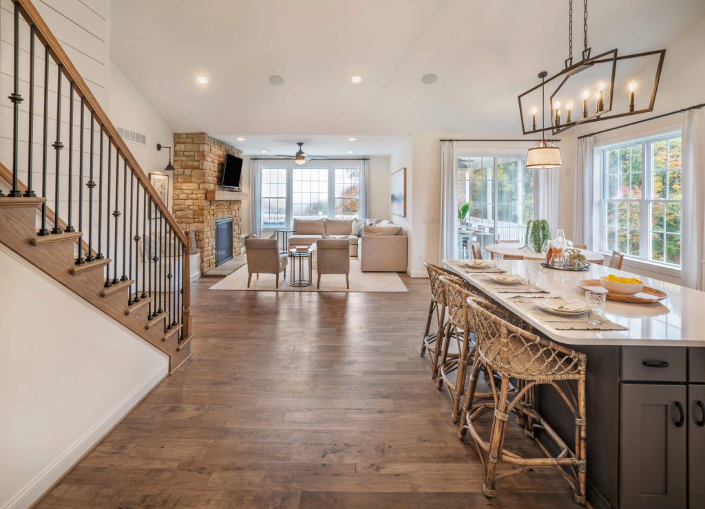 Kitchen with great room in background in a hancock model from Traditions of America