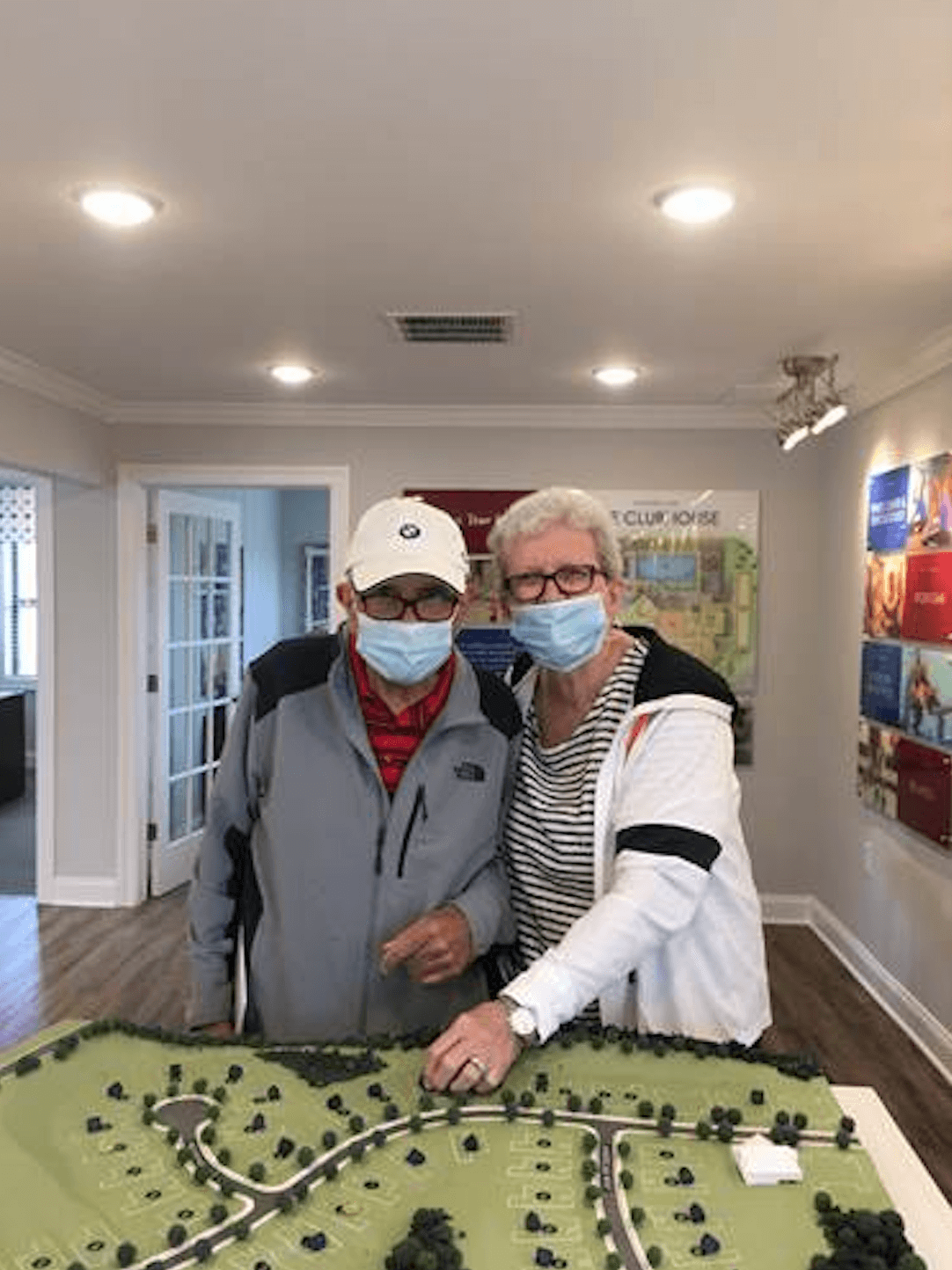 People picking their plot on a Traditions of America community model